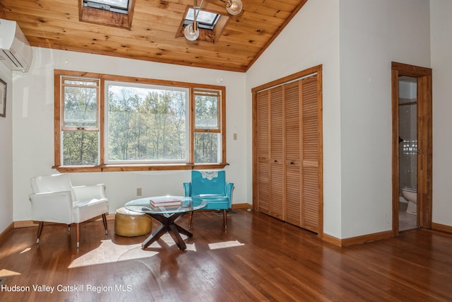 sitting room with a wall mounted air conditioner, dark hardwood / wood-style flooring, lofted ceiling with skylight, and wood ceiling