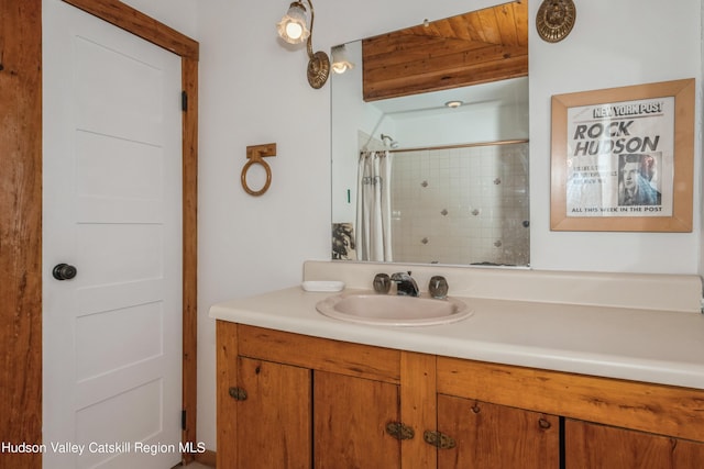 bathroom with vanity and curtained shower