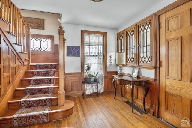 3630 Main St, Stone Ridge, NY 12484 - entryway with wainscoting, stairs, and light wood finished floors