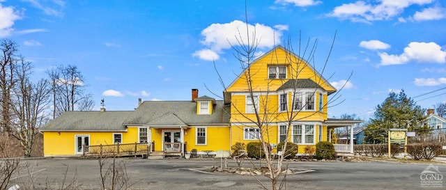 3630 Main St, Stone Ridge, NY 12484 - view of front facade featuring a wooden deck and a chimney