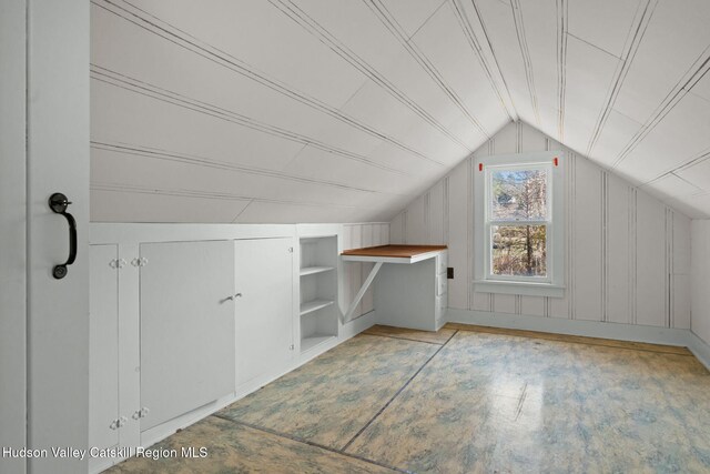 bonus room with vaulted ceiling