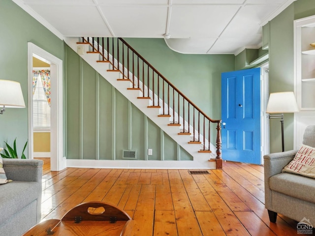 stairway featuring hardwood / wood-style floors