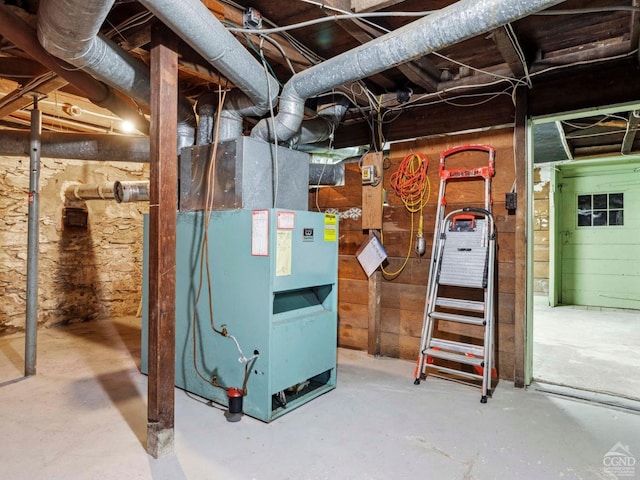 utility room with heating unit
