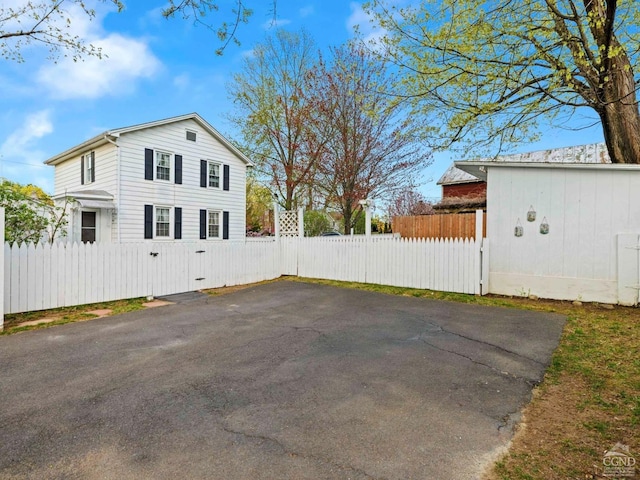 view of side of home with fence