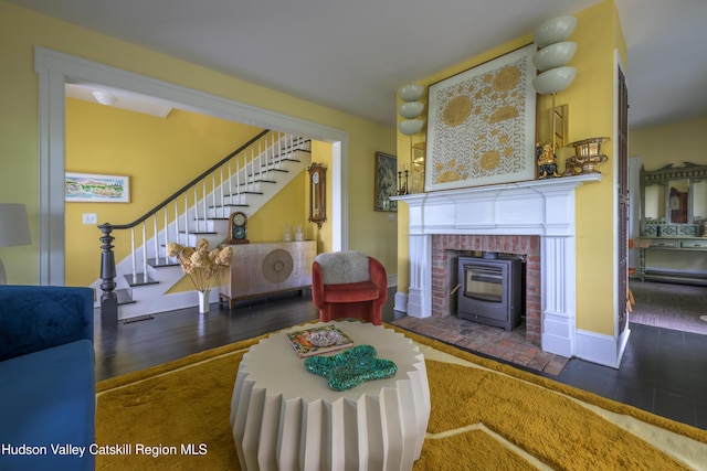 28 Riverview St, Stuyvesant, NY 12173 - living room featuring wood finished floors, stairs, and a brick fireplace