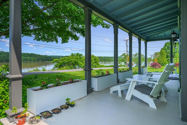 28 Riverview St, Stuyvesant, NY 12173 - unfurnished sunroom featuring a water view, expansive windows, and vaulted ceiling