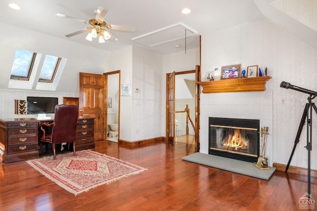 237 Christian Hill Rd, Cooperstown, NY 13326 - office area with attic access, wood finished floors, a tile fireplace, a ceiling fan, and baseboards