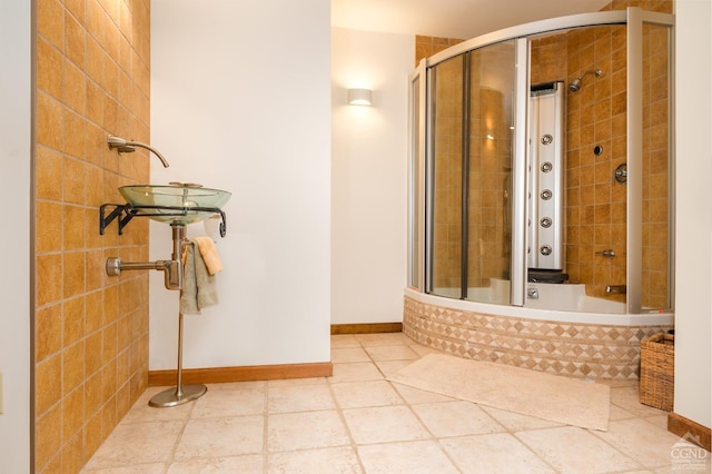 237 Christian Hill Rd, Cooperstown, NY 13326 - bathroom featuring baseboards and tiled shower / bath