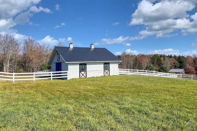 237 Christian Hill Rd, Cooperstown, NY 13326 - view of side of property featuring a chimney, metal roof, and an outdoor structure