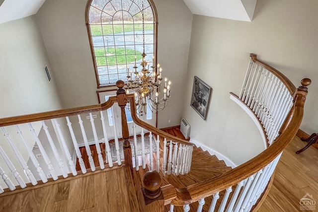237 Christian Hill Rd, Cooperstown, NY 13326 - stairway featuring wood finished floors, a chandelier, and baseboards