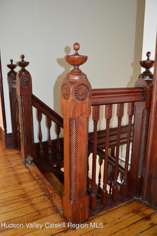 stairway featuring hardwood / wood-style floors