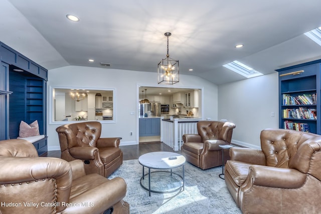 living area with baseboards, visible vents, lofted ceiling with skylight, light wood-style floors, and recessed lighting