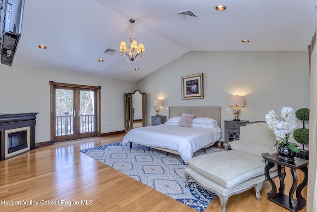 bedroom with access to exterior, light wood-style flooring, visible vents, and french doors