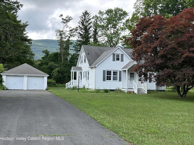 969 Blue Mountain Rd, Saugerties, NY 12477 - view of front facade featuring an outdoor structure, a garage, and a front yard