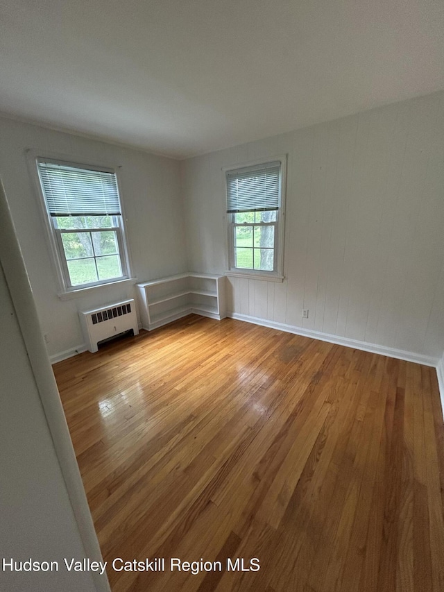 969 Blue Mountain Rd, Saugerties, NY 12477 - spare room featuring wood finished floors and radiator heating unit