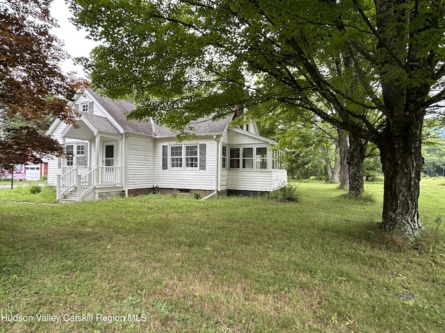 969 Blue Mountain Rd, Saugerties, NY 12477 - rear view of property featuring a shingled roof, crawl space, a yard, and a sunroom