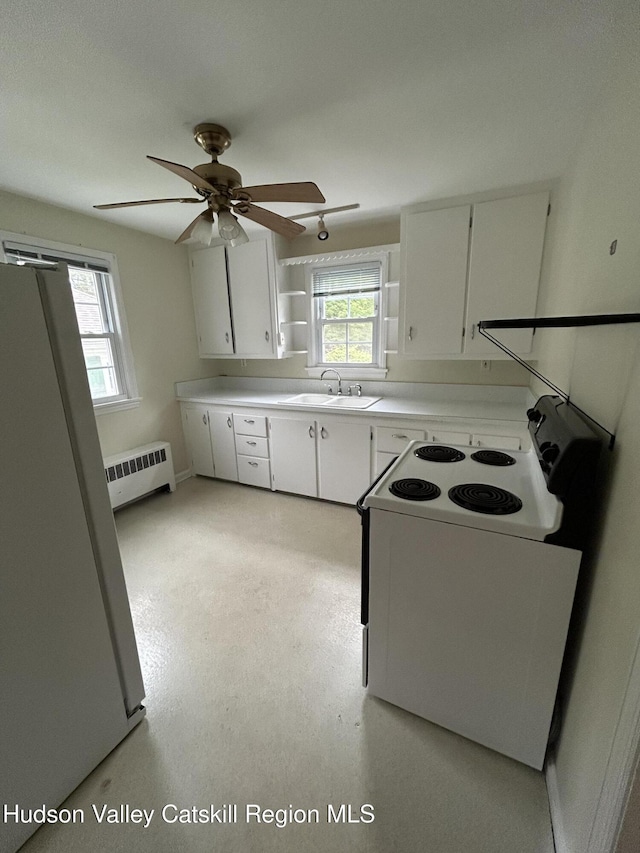 969 Blue Mountain Rd, Saugerties, NY 12477 - kitchen with white electric range oven, freestanding refrigerator, white cabinets, a ceiling fan, and light countertops