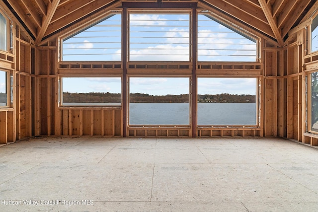 miscellaneous room with a water view and lofted ceiling