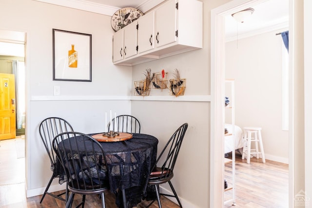 550-552 Columbia St, Hudson, NY 12534 - dining area featuring ornamental molding, light wood finished floors, and baseboards