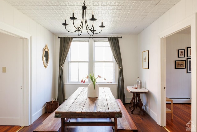 550-552 Columbia St, Hudson, NY 12534 - dining area featuring a chandelier, a baseboard heating unit, dark wood-style flooring, baseboards, and an ornate ceiling