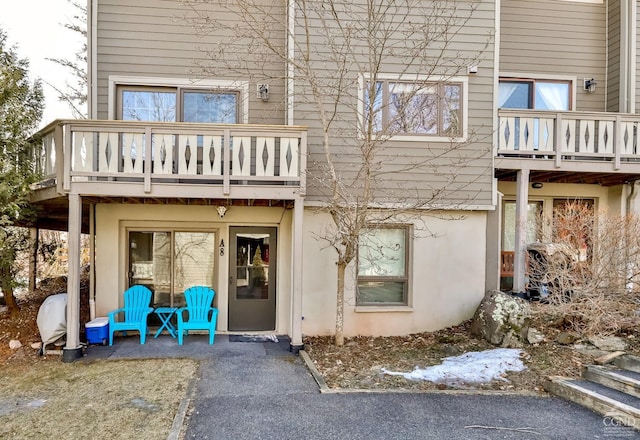 92 Highlands Ln Unit A8, Hunter, NY 12442 - back of property featuring a balcony and stucco siding