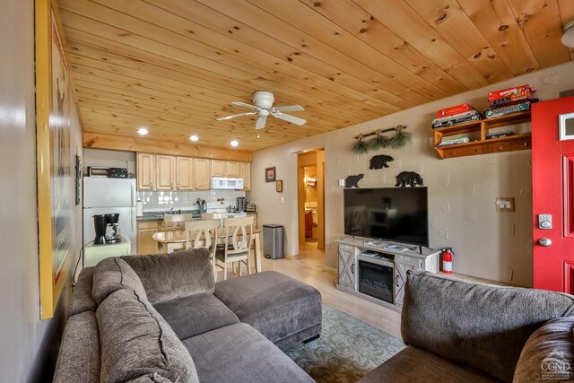 92 Highlands Ln Unit A8, Hunter, NY 12442 - living room with ceiling fan, wood ceiling, and a fireplace