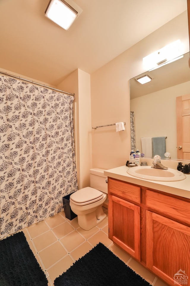 full bath featuring toilet, vanity, and curtained shower