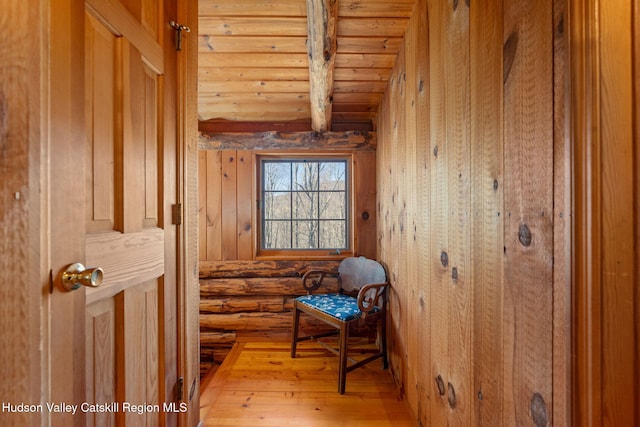 interior space featuring rustic walls and hardwood / wood-style flooring