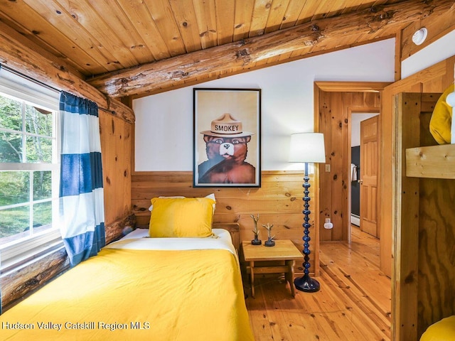 bedroom featuring vaulted ceiling with beams, wood walls, wood-type flooring, and wood ceiling