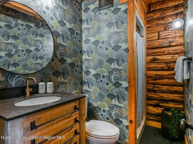 bathroom featuring vanity, toilet, and walk in shower