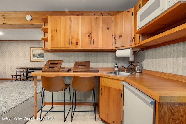 kitchen with white appliances and sink