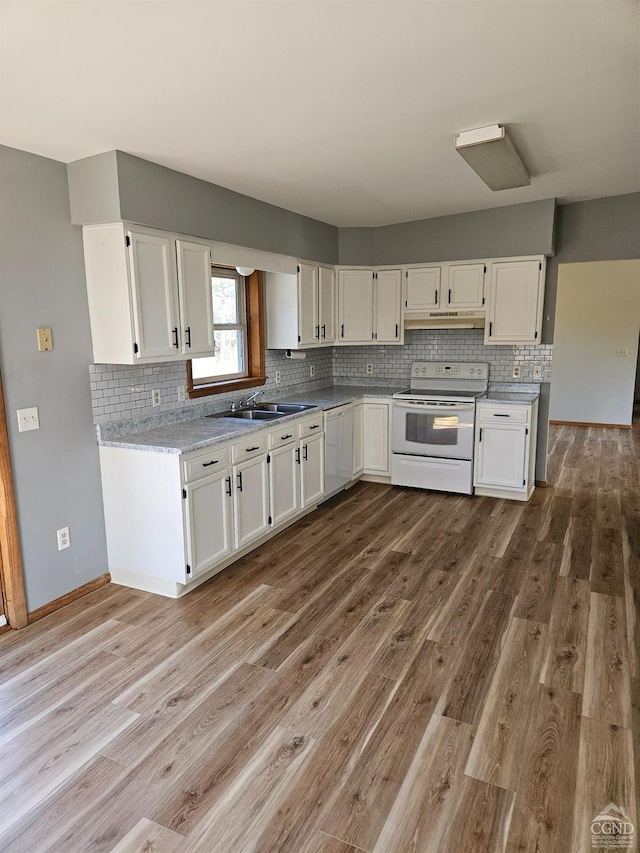 186 Meadow Brook Ln, Greenville, NY 12083 - kitchen with white appliances, under cabinet range hood, white cabinetry, and wood finished floors