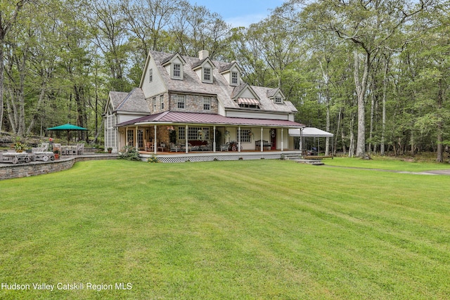 465 High Point Mountain Rd, West Shokan, NY 12494 - view of front of home with a standing seam roof, a front yard, a porch, and metal roof