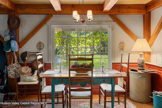 465 High Point Mountain Rd, West Shokan, NY 12494 - dining area with beam ceiling, light wood-style floors, a chandelier, and wainscoting