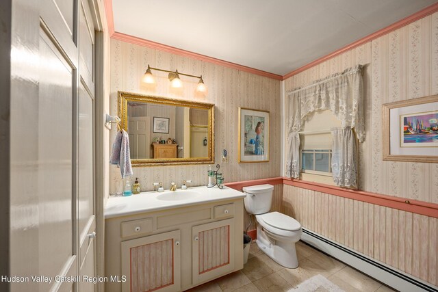 465 High Point Mountain Rd, West Shokan, NY 12494 - bathroom with a baseboard heating unit, wallpapered walls, toilet, ornamental molding, and vanity