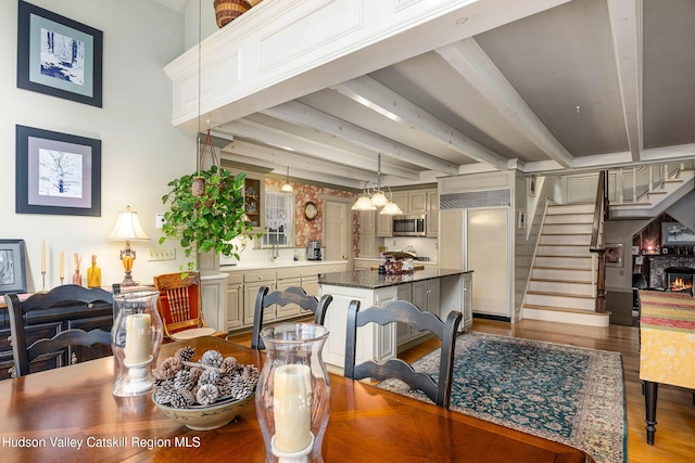 465 High Point Mountain Rd, West Shokan, NY 12494 - dining room with wood finished floors, beam ceiling, and stairs