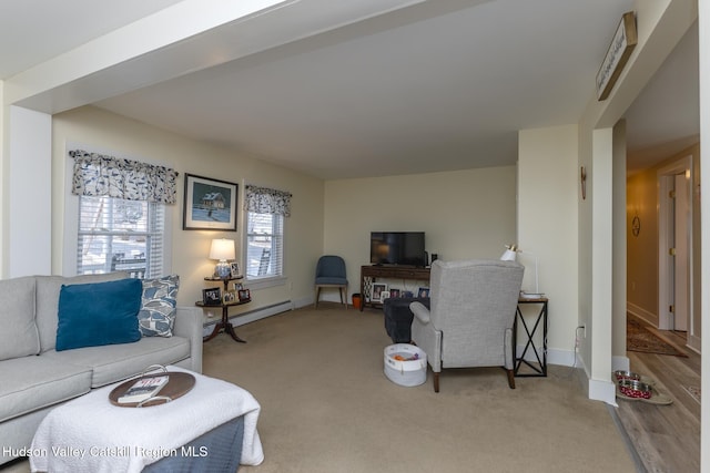 carpeted living room featuring a baseboard radiator