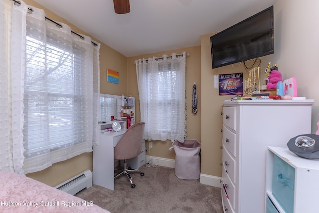 bedroom with light carpet, baseboard heating, and ceiling fan