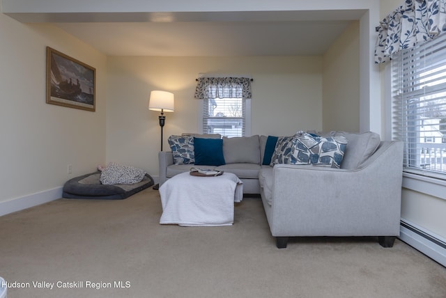 living room with a baseboard radiator and carpet flooring