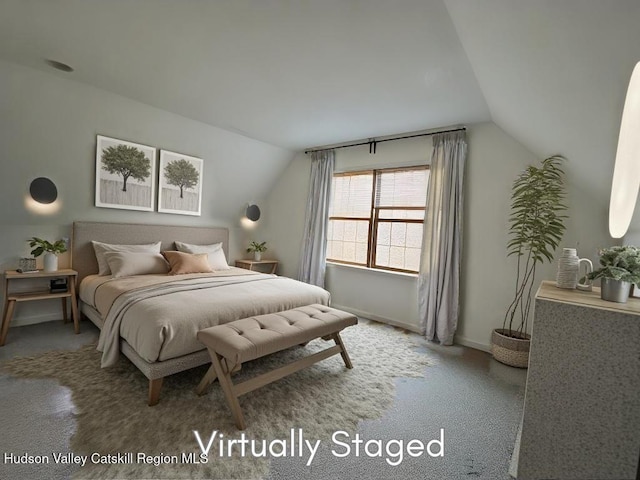 carpeted bedroom featuring vaulted ceiling