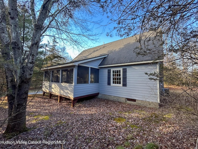 back of property featuring a sunroom