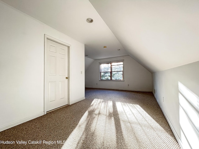 bonus room featuring carpet floors and lofted ceiling