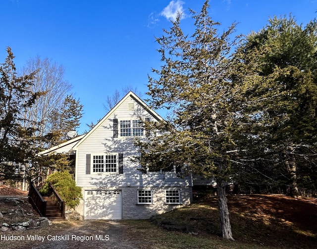 view of property exterior featuring a garage