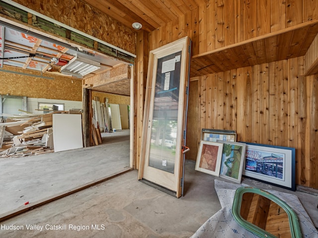 125 Water St, Franklin, NY 13775 - misc room with wooden walls and unfinished concrete flooring