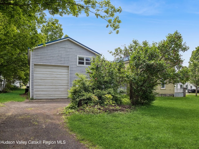 125 Water St, Franklin, NY 13775 - view of side of home with a garage, a yard, and driveway