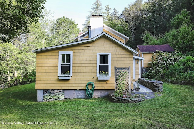 10 Erickson Rd, Hardenburgh, NY 12406 - back of house featuring a chimney and a lawn