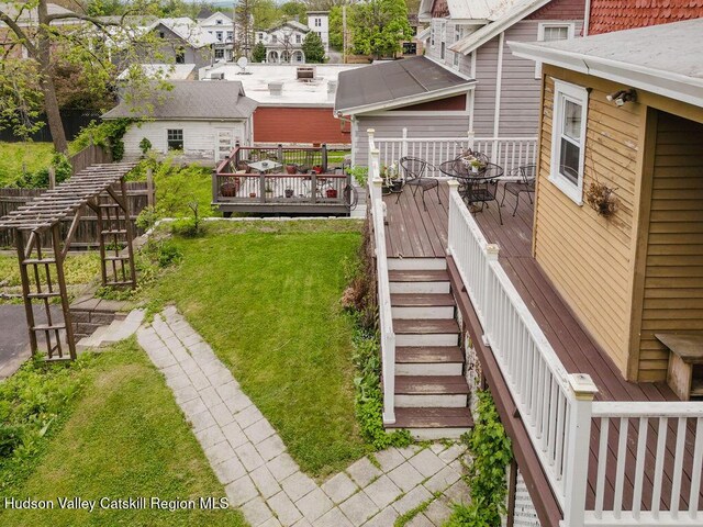 15 Mckinstry Pl, Hudson, NY 12534 - view of green lawn with stairs, a wooden deck, and a residential view