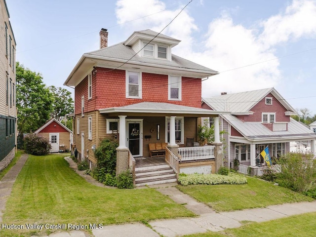 15 Mckinstry Pl, Hudson, NY 12534 - traditional style home featuring a porch, a chimney, and a front lawn