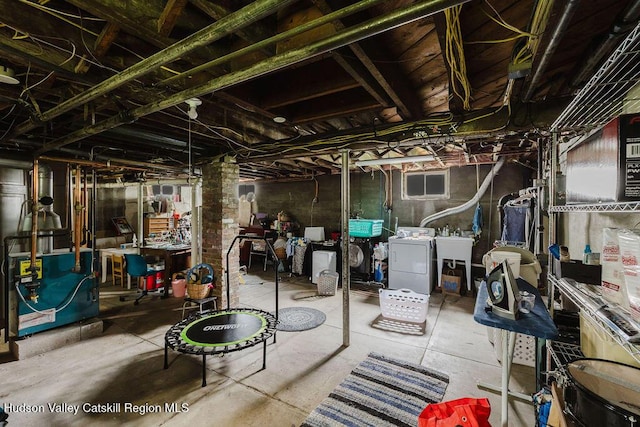 15 Mckinstry Pl, Hudson, NY 12534 - unfinished basement with washer / clothes dryer and a heating unit
