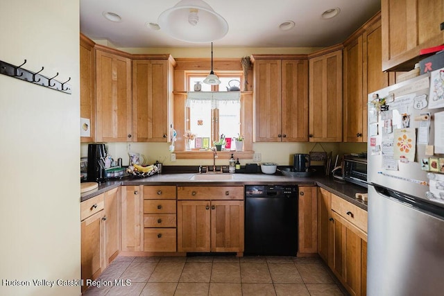 15 Mckinstry Pl, Hudson, NY 12534 - kitchen with freestanding refrigerator, dishwasher, a sink, dark countertops, and light tile patterned floors